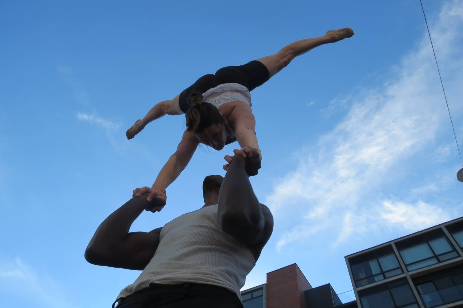 Lex Peters performing acro yoga